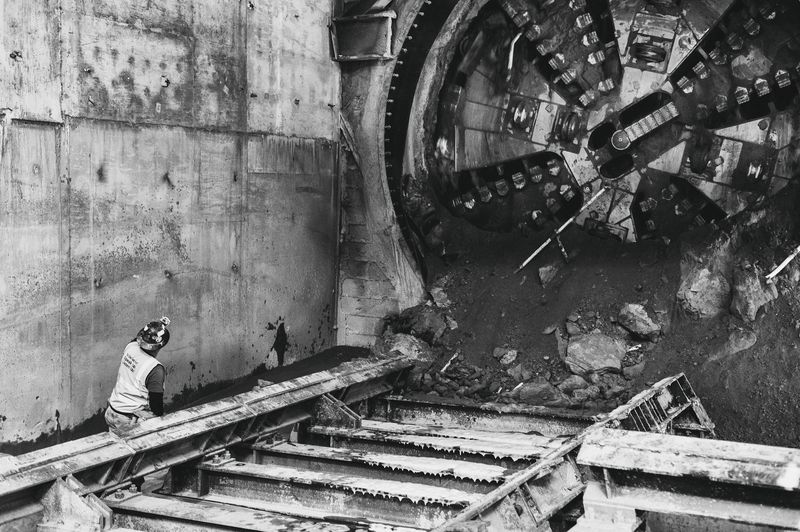 Closeup shot of tunnel boring machine breaking through wall